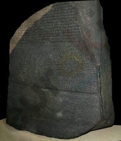 A stone with text on it Description automatically generated with low confidence